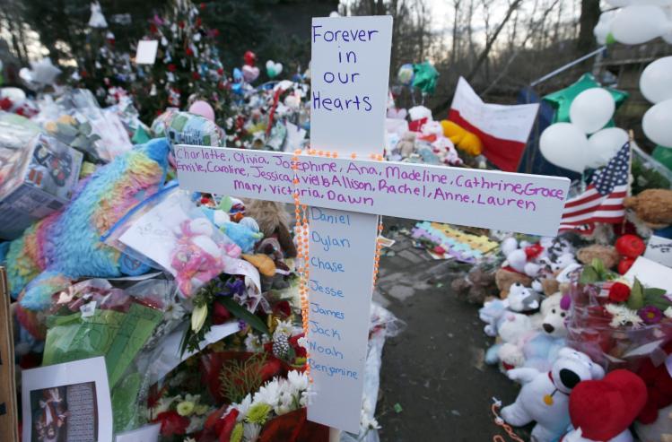 A cross bearing the first names of the victims of the 2012 shootings at Sandy Hook Elementary School / CNS photo