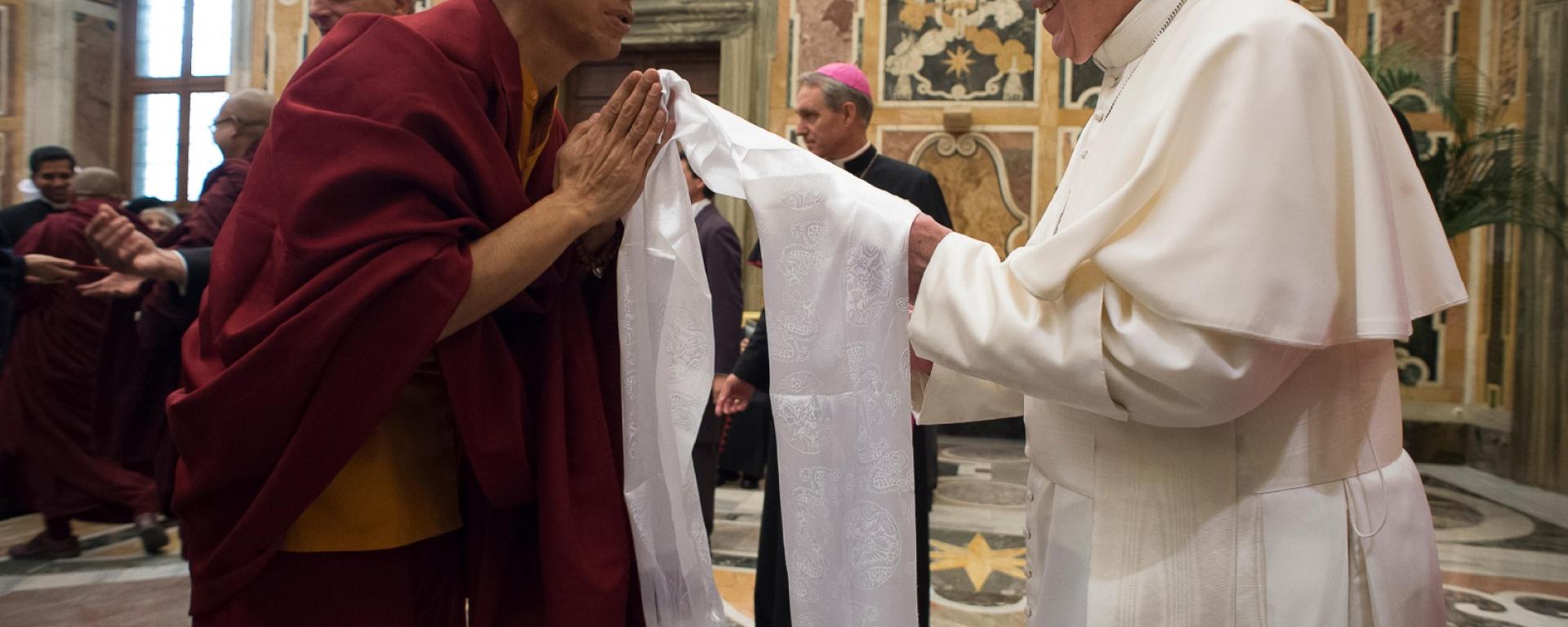 Pope Francis greets a Buddhist monk during a November audience with religious leaders at the Vatican / CNS photo